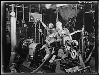 Halftrac scout cars. The dynamometer (power measurer to you) makes an engine prove its right to go to work on one of the Army's new halftrac scout cars. The Midwest manufacturer of this engine produces the complete car. White Motor Company, Cleveland, Ohio. Sourced from the Library of Congress.