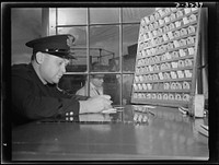 Truckers bringing supplies, people performing essential services, anyone with a legitimate reason can enter a defense plant, but he and his business must first be known. During his visit he must wear an identification badge issued by the plant police. White Motor Company, Cleveland, Ohio. Sourced from the Library of Congress.