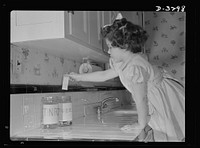 Conservation of durable goods. That's no idle whim of Uncle Sam's; these empty tubes you turn in before buying more are converted into essential products. Vital tin and alloy metals conserved by this procedure. Sourced from the Library of Congress.