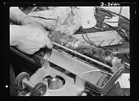 Portrait of a mistreated vacuum cleaner. It's in the repair shop because it inhaled bits of metal, pieces of wire, hairpins,and other harmful objects. Keep the machine away from such things, clean the brushes and belt regularly, and empty the bag at least once a week. Sourced from the Library of Congress.