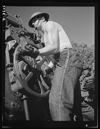 Fort Story coast defense. One of Uncle Sam's fighting men at Fort Story, Virginia adjusts the range on one of the giant guns which line the shore. Fort Story, Virginia. Sourced from the Library of Congress.