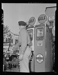 Every citizen can get his share. Our democratic way of sharing the limited amount of gasoline means a new stance for the service station attendant. He keeps an eye on the guage instead of on the tank. Every man gets what is coming to him--no more. Sourced from the Library of Congress.