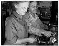 De Land pool. La Roe shop. Fifty-three-year-old Earl La Roe and his wife, of Eustis, Louisiana, solved one of the De Land industrial pool's most difficult problems by subcontracting part of a war order in their garage workshop. Mr. La Roe helps his wife in the operation of cutting worm gears on their machine. Sourced from the Library of Congress.
