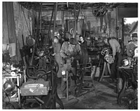 De Land pool. La Roe shop. Interior of the La Roe garage shop at Eustis, Louisiana, showing the precision machines on which the La Roe family is turning out vital parts for a million-dollar pool war contract centering at De Land, Florida. Sourced from the Library of Congress.