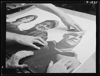 A poster comes to life. Blown up almost to life-size, photographs of the soldier, welder and sailor are pasted on cardboard. The poster of "Men Working Together" which actually brought these three men typical of their specific groups together thus begins to take shape. Allegheny-Ludlum Steel, Pittsburgh, Pennsylvania. Sourced from the Library of Congress.