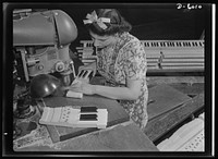 Conversion. Pianos to airplane motors. From piano keys to parts for trainer planes. Lorraine Avezzano, pictured at work in a Chicago piano factory prior to its conversion to war production. She uses the same boring machine today to process parts for Uncle Sam's trainer planes. Gulbransen Company. Sourced from the Library of Congress.