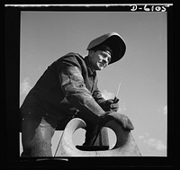 Production. Submarine chasers. An answer to the U-boats: more subchasers. A husky arc welder has just finished a job on one of the chocks of a chaser at an Eastern boatyard. Marine Construction Company, Stamford, Connecticut. Sourced from the Library of Congress.