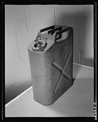 Substitute materials containers. New army "blitz" can. A five-gallon metal container for water, oil, or gasoline, constructed with air spaces to prevent sinking. Sourced from the Library of Congress.