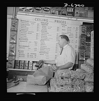 Posting ceiling prices in foreign languages. Greek-speaking customers of Spiros Margrite are fully acquainted with the ceiling prices in Margarite's grocery store, for everything is carefully listed on this large sign. By cooperating with the Office of Price Administration's (OPA) fight against inflation, Mr. Margarite is helping to destroy the forces which have banished freedom from his native land and threatened the freedom of his adopted country. Sourced from the Library of Congress.