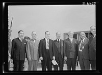 Ship launching in Portland, Maine. Officials who assisted in the launching ceremonies for eight vessels at a New England shipyard August 16, 1942. Left to right: Senator Claude Pepper of Florida; Senator Harry S. Truman of Missouri; Governor Sumner Sewall of Maine; Senator Ralph Brewster of Maine; John D. Reilly, President of Todd Shipyards Corporation; William S. Newell, President of Bath Iron Works Corporation and Todd-Bath Iron Shipbuilding Corporation; Senator Harley M. Kilgore of West Virginia. Sourced from the Library of Congress.