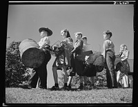 Manpower, junior size. Too young to help? Not the youngsters of Roanoke, Virginia. They're out to win the war by gathering up every piece of scrap metal, every bit of worn out rubber, and all waste fats and greases in the town. Sourced from the Library of Congress.