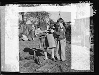 Manpower, junior size. It takes a good right arm to collect all the household scrap that's needed for the nation's armaments, and these Roanoke, Virginia youngsters have just what it takes. Note the badge on the boy's collar; it reads "Lieutenant: Junior Commando Salvage Drive". Sourced from the Library of Congress.