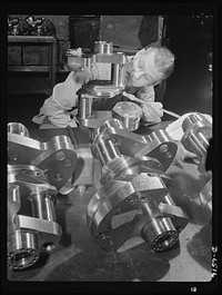 Production. Pratt and Whitney airplane engines. Crankshaft assembles for Pratt and Whitney airplane engines must undergo a rigid inspection in a large Eastern war plant now working full tilt to supply our armed forces with power installations for our war planes. Pratt and Whitney Aircraft. Sourced from the Library of Congress.