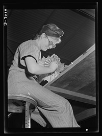 Women in war. Supercharger plant workers. Emily Sauermilch, baker, has taken her place in America's army of war workers. Employed in a large Midwest supercharger plant, she puts the finishing touches on impellors part of the airplane motor. Allis Manufacture Company. Sourced from the Library of Congress.