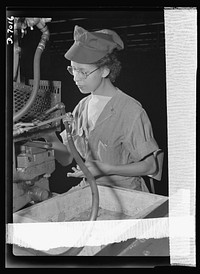 Women in war. Supercharger plant workers. Kay Lamphear, half American Indian and half Scotch-Norwegian, has joined the growing army of American women war workers. Employed by a large Midwest supercharger plant, this 21-year-old former costumes model operates a punch press, machining diaphragm blades for airplane engines. Allis Chalmers Manufacture Company. Sourced from the Library of Congress.