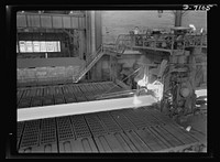 Salvage. Scrap for steel mills. From these giant rolling machines flow lengths of molten steel--steel composed partly of roller skates, reapers, radiators and other scrap collected from America's homes and farms. This strip steel will see action as armor plate on the nation's tanks or battleships. Sourced from the Library of Congress.