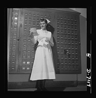 Nurse training. Highlighting a day of intensive training, mail from home brings a smile to this young student nurse's face. Sourced from the Library of Congress.