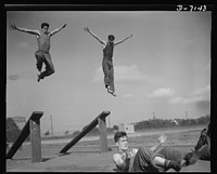 High school Victory Corps. By the time these boys are old enough to join America's fighting forces they will be toughened to commando standards. Flushing High School, Queens, New York, has expanded its physical education activities to include the type of training made necessary by wartime. Sourced from the Library of Congress.