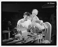 High school Victory Corps. Polytechnic High School, Los Angeles, California, teaches its students trades which fit them to help in the war program. This Chinese student is learning to operate a lathe. Sourced from the Library of Congress.
