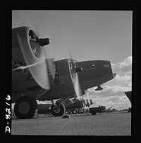 Production. B-17 heavy bomber. Two of the four mighty engines of a new B-17F (Flying Fortress) bombers warm up at the airfield of Boeing's Seattle plant as another warship of the air awaits its flight test. The Flying Fortress has performed with great credit in the South Pacific, over Germany and elsewhere. It is a four-engine heavy bomber capable of flying at high altitudes. Sourced from the Library of Congress.