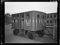 War wagon trailer. This new war wagon trailer made almost entirely of non-critical materials is being tried out in localities where war industry traffic is heavy. Built on a steel frame, the coach is made principally of wood and masonite. Sourced from the Library of Congress.