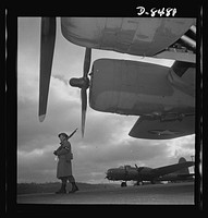 Production. B-17 heavy bomber. An Army sentry guards new B-17F (Flying Fortress) bombers at the airfield of Boeing's Seattle plant. The ship will be delivered to the Army and the Navy after they have successfully undergone flight tests. The Flying Fortress has performed with great credit in the South Pacific, over Germany and elsewhere. It is a four-engine heavy bomber capable of flying at high altitudes. Sourced from the Library of Congress.