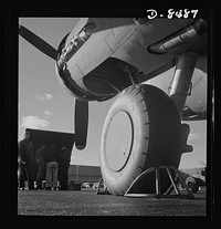 Production. B-17 heavy bomber. One of the huge landing wheels of a new B-17F (Flying Fortress) bomber ready for flight tests at the airfield of Boeing's Seattle plant. The Flying Fortress has performed with great credit in the South Pacific, over Germany and elsewhere. It is a four-engine heavy bomber capable of flying at high altitudes. Sourced from the Library of Congress.