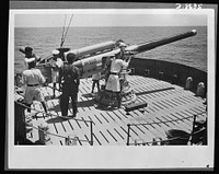 India in the war. On duty with seamen of the Royal Indian Navy on active service in Eastern waters. Captured Italian equipment on board often proves these ships have engaged in successful action. Sourced from the Library of Congress.