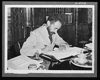 American military delegation calling on Haile Selassie. While visited by the American delegation, His Majesty, Haile Sellassie, Emperor of Ethiopia, took time off to pen a letter to President Roosevelt. He is shown here signing the letter, which was rushed by army plane to the White House. These pictures are the first to be taken for publication since His Majesty's return to become a fighting member of the United Nations. Sourced from the Library of Congress.