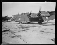 Production. B-24E (Liberator) bombers at Willow Run. A new B-24E (Liberator) bomber, named for Captain Eddie Rickenbacker and bearing his autograph returns to the airfield at Ford's big Willow Run plant after a successful trial flight. The Liberator is capable of operation at altitudes and over great ranges on precision bombing missions. It has proved itself an excellent performer in the Pacific, in Northern Africa, Europe and the Aleutians. Ford's Willow Run Plant, Michigan. Sourced from the Library of Congress.