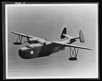 Aircraft. Naval. The Consolidated "Mariner" (PBM-3) serves the Navy as a patrol bomber or transport. It is an all-metal flying boat with high gull wings. It has a speed of over 200 miles per hour, a range of over 3,000 miles, a ceiling of over 15,000 feet and a load capacity of 20,000 pounds. The crew of nine men is armed with 50-caliber machine guns and bombs. Sourced from the Library of Congress.