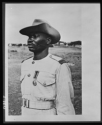 Decorated for gallantry in action. Private Bukaro Frafra, Gold Coast Regiment, Royal West African Frontier Force, who has been awarded the Imperial Distinguished Conduct Medal for gallantry in the East African campaign. In April, 1941, as a member of a patrol sent out to find its way over a ravine and across a tank trap, he work his Bren gun forward to within fifty yards of the tank trap, inflicting seven casualties on an enemy party working beyond it. On April 1941, under very heavy fire, he was wounded but refused to give in. He stuck to his gun until it was knocked out of action and he was wounded a second time. He is one of the first three African soldiers to receive the Imperial Distinguished Conduct Medal. Sourced from the Library of Congress.