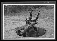 Reciprocal aid. American and British air forces work together in defense of a British airfield. A member of the Royal Air Force handles the anti-aircraft gun in the foreground with American fighting forces shown in the rear. Many airfields and much British equipment have been provided for American air forces under the British Reciprocal Aid Program. Sourced from the Library of Congress.