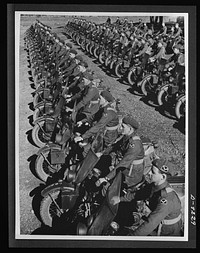 Australia in the war. Dispatch riders of an Australian armored division lined up for review. These are American motorcycles, furnished under the lend-lease program. Sourced from the Library of Congress.