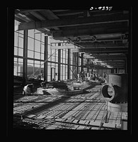 Production. Magnesium. High above the Nevada desert workmen lay reinforcing steel for the concrete floor of one of the 360-foot-long chlorination buildings at Basic Magnesium's huge plant near Las Vegas. Sourced from the Library of Congress.