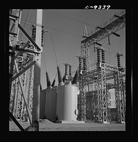 Production. Magnesium. A veritable forest of transmission towers and transformers distribute electrical power to the various units of Basic Magnesium's huge plant in the southern Nevada desert. Some units of this plant are now producing magnesium, lightest of all metals, for incendiary bombs, tracer bullets and aircraft parts. Full production is scheduled for the summer of 1943. Sourced from the Library of Congress.