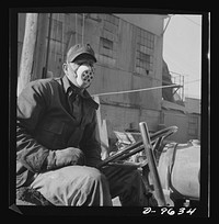 Production. Zinc. The operator of a zinc ore leader at a large smelting plant is protected against harmful dust by a mask. From the Eagle-Picher plant near Cardin, Oklahoma, come great quantities of zinc and lead to serve many important purposes in the war effort. Sourced from the Library of Congress.