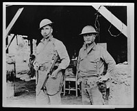 Brothers in arms. Typical of the 10,000 Americans who helped to stall Japan's forces on Bataan was Captain Arthur W. Wermuth (left) shown here with his Filipino aide. During the four months of fighting in Bataan, Captain Wermuth and his aide accounted for over a hundred of the enemy. Sourced from the Library of Congress.