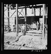 Production. Copper (refining). Sheets of copper produced by electrolysis at a large refining operation. These will be melted and cast into ingots. Large amounts of copper are produced for the war effort at the El Paso, Texas plant of Phelps-Dodge Refining Company. Sourced from the Library of Congress.