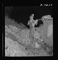 Production. Zinc. Loading zinc ore in a mine serving a large concentrator. From the Eagle-Picher plant near Cardin, Oklahoma, come great quantities of zinc and lead to serve many important purposes in the war effort. Sourced from the Library of Congress.