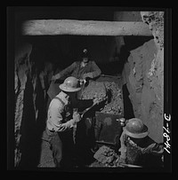 Production. Lead. Loading lead ore at a mine near Creede, Colorado. Creede, for many years a "ghost town," has resumed the activities that made it an important lead-producing center years ago, and is now producing much metal vitally needed for the war effort. Sourced from the Library of Congress.