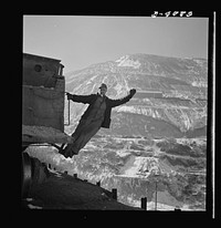 Utah Copper: Bingham Mine. Brakeman of an ore train at the open-pit mining operations of Utah Copper Company, at Bingham Canyon, Utah. Sourced from the Library of Congress.