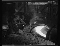 Production. Copper. Tapping copper matte from a blast furnace at the Garfield, Utah smelter of the American Smelting and Refining Company. This plant is producing vast quantities of copper so vital for war purposes. Sourced from the Library of Congress.