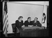 Director F.H. LaGuardia (center) and Mrs. Eleanor Roosevelt, assistant director of the Office of Civilian Defense with Dean James M. Landis (right) of the Harvard Law School on the occasion of his arrival in Washington to assume his new duties as in the Office of Civilian Defense. Sourced from the Library of Congress.