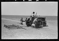 [Untitled photo, possibly related to: Tractor with planter and go-devil attached, large farm near Ralls, Texas] by Russell Lee