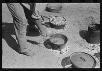 Ranch cook stirring chili. Roundup near Marfa, Texas by Russell Lee