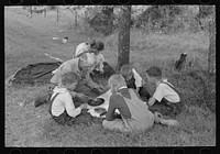 White migrant family eating lunch of berry pie on the highway east of Fort Gibson, Muskogee County, Oklahoma by Russell Lee