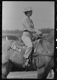 [Untitled photo, possibly related to: Watching polo match, Abilene, Texas] by Russell Lee