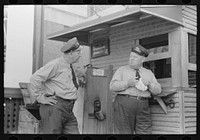 Streetcar operators talking in terminal, Oklahoma City, Oklahoma by Russell Lee