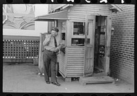 Streetcar motorman in front of station master's shack, streetcar and interurban station, Oklahoma City, Oklahoma by Russell Lee